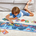 Hape dinosaurus puzzel 210 stukjes - glow in the dark vloerpuzzel met dinosaurus feitenkaarten, 6+