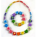 Holzperlenkette und Armband mit Herzen von Simply For Kids